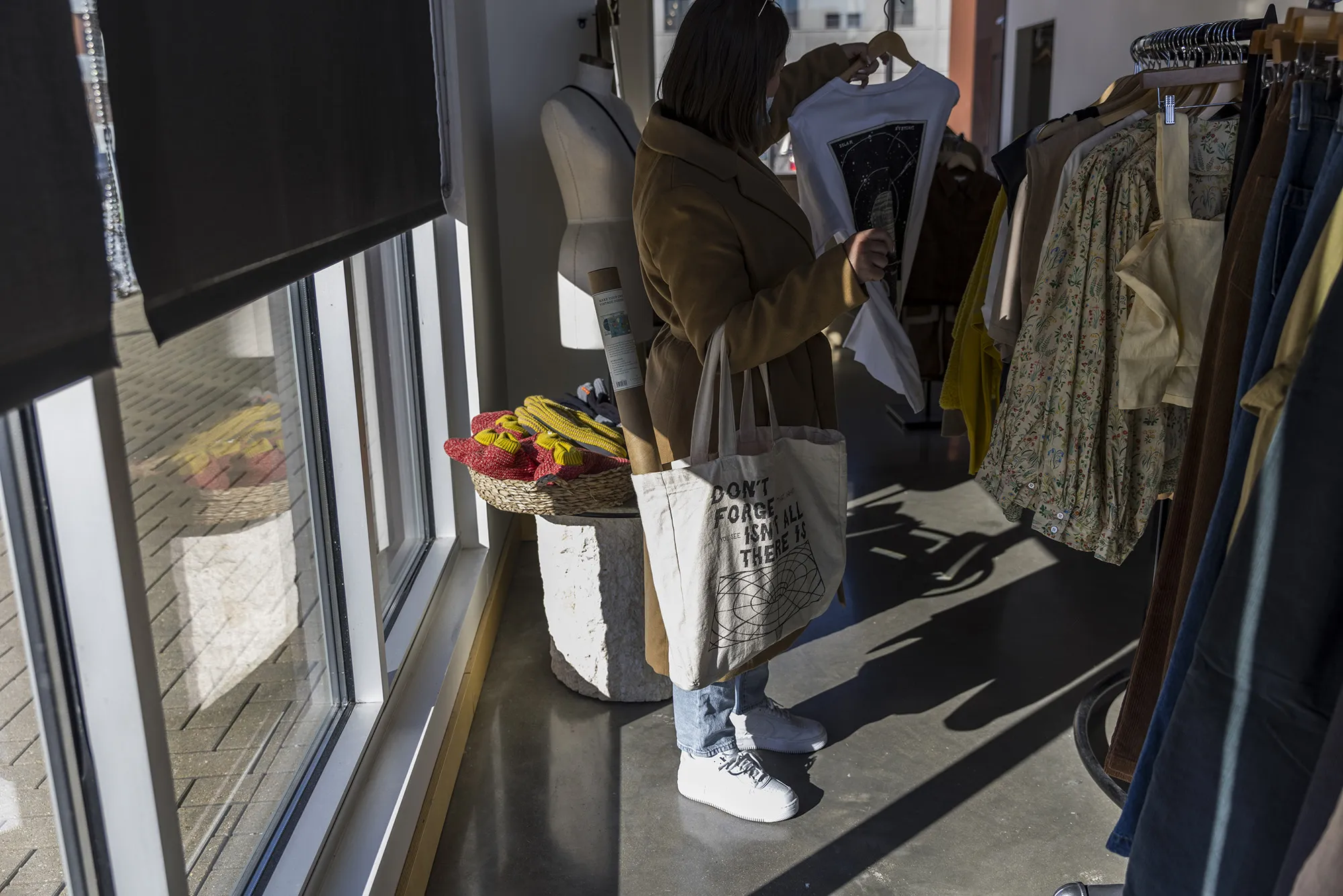 A shopper inside a clothing store in the East Village neighborhood of Des Moines, Iowa.