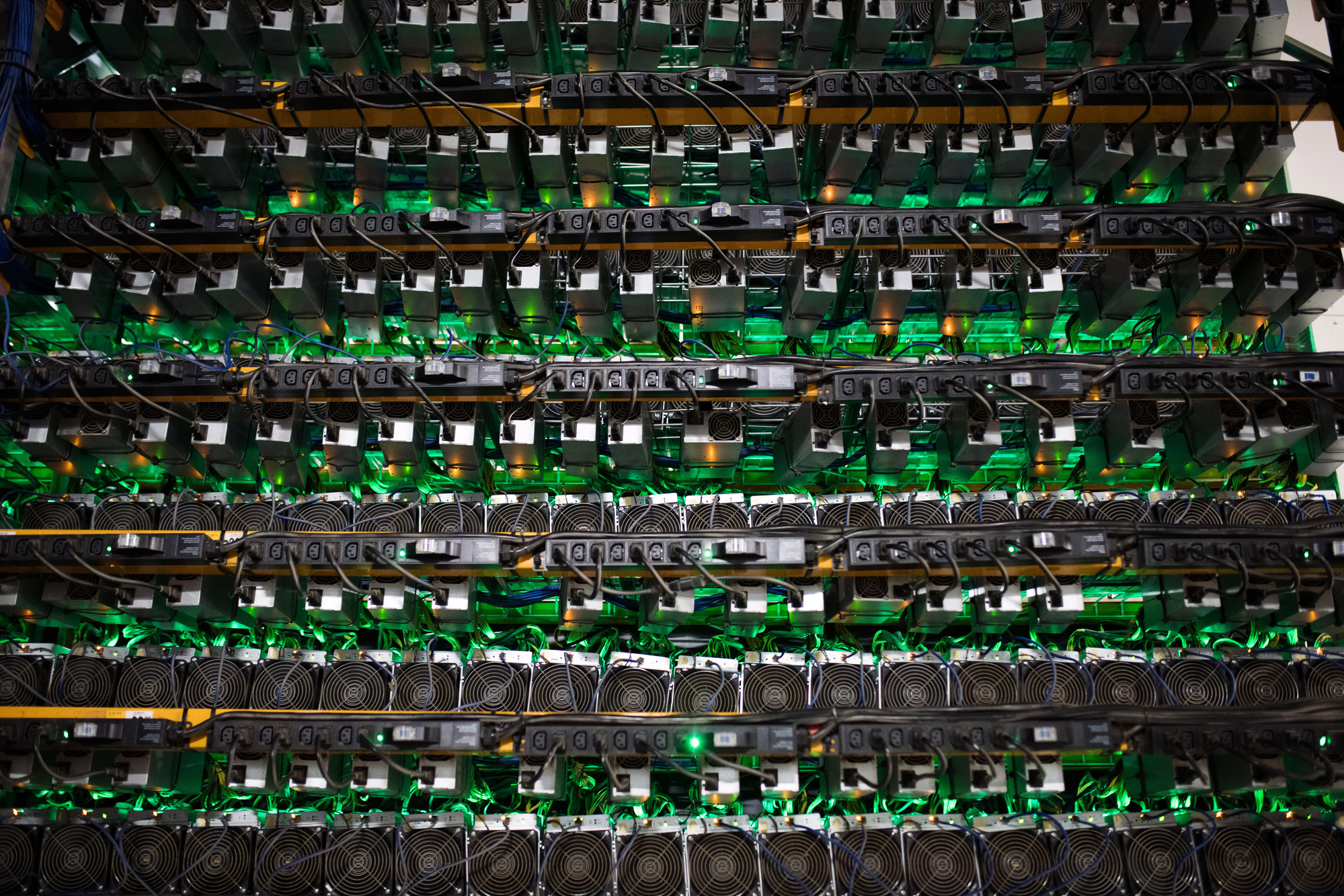 Cryptocurrency mining rigs sit on racks at a Bitfarms facility in Saint-Hyacinthe, Quebec, Canada, on Thursday, July 26, 2018. Bitcoin has rallied more than 30 percent in July, shrugging off security and regulatory concerns that have plagued the virtual currency for much of this year.