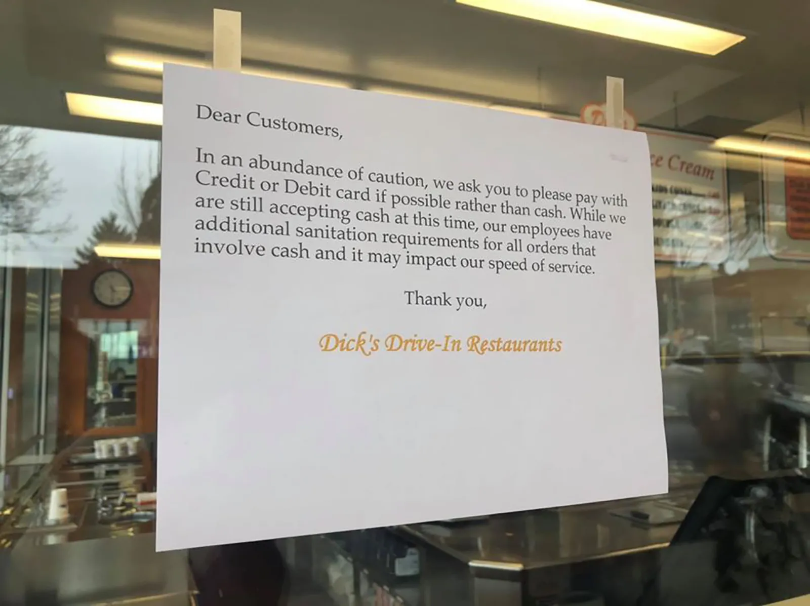Dick’s management placed notes requesting customers use credit or debit cards in lieu of cash.