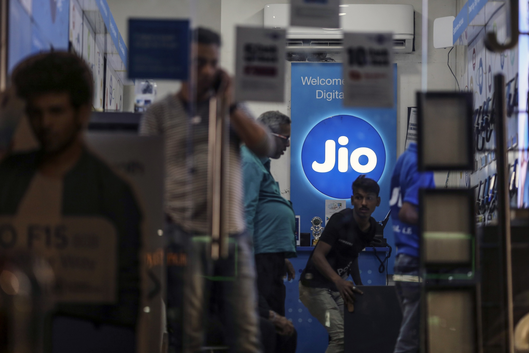 The logo of Reliance Jio is displayed inside a store in Mumbai.