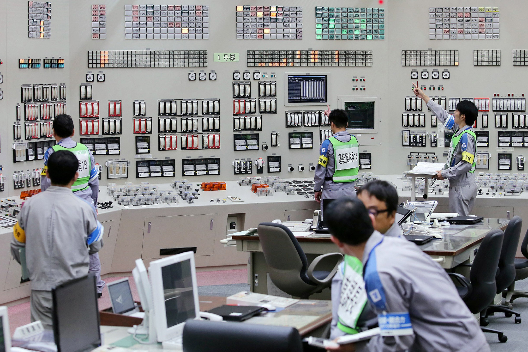 Operators restart the nuclear reactor inside the Kyushu Electric Power Sendai plant in Japan on August 11, 2015. Photographer: Jiji Press/AFP/Getty Images
