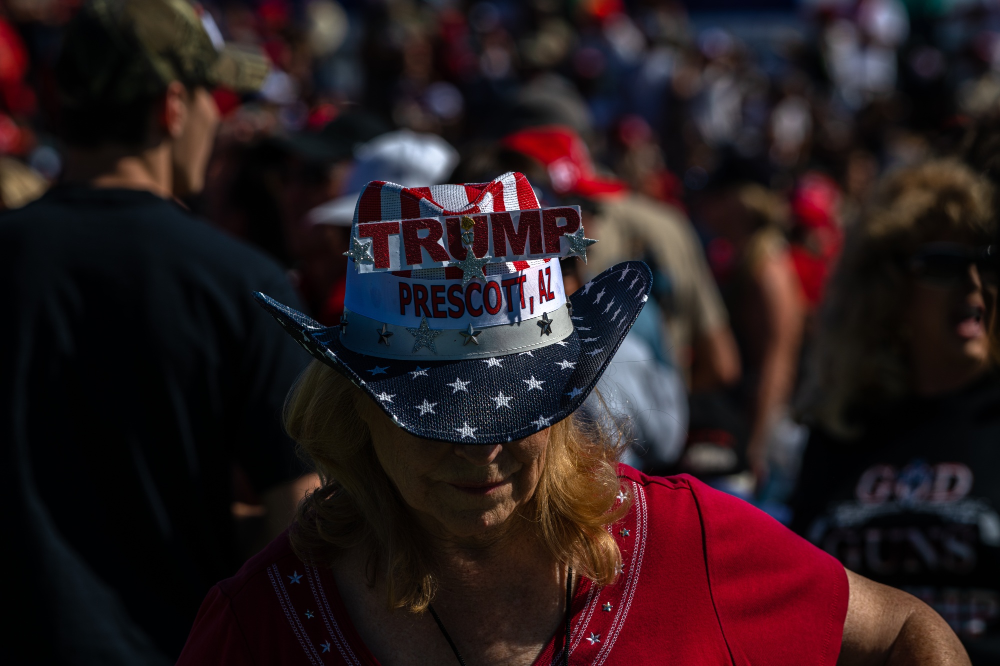 An attendee wears a hat displaying the colors of the American flag ahead of the arrival of Donald Trump at a Make America Great Again rally in Prescott, Arizona, on Oct. 19.