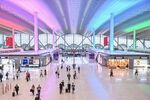 Passengers walk through the departure hall at Baiyun International airport in Guangzhou, China, on&nbsp;Oct. 1, 2020.