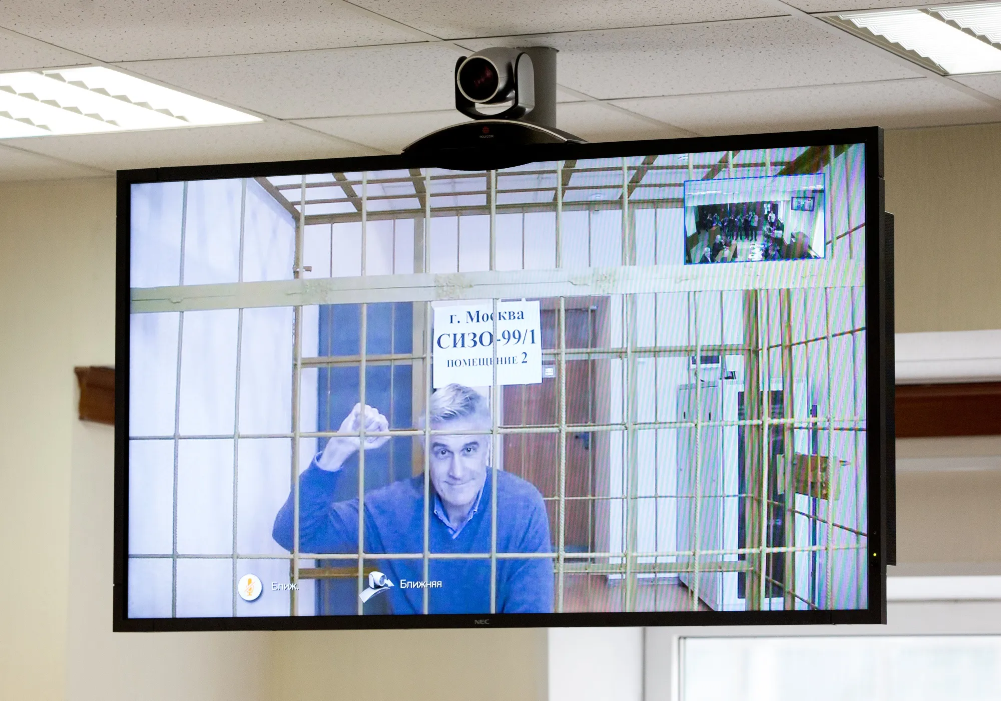 Michael Calvey appears on a television screen via a video-link during a hearing in Moscow on Feb. 28.