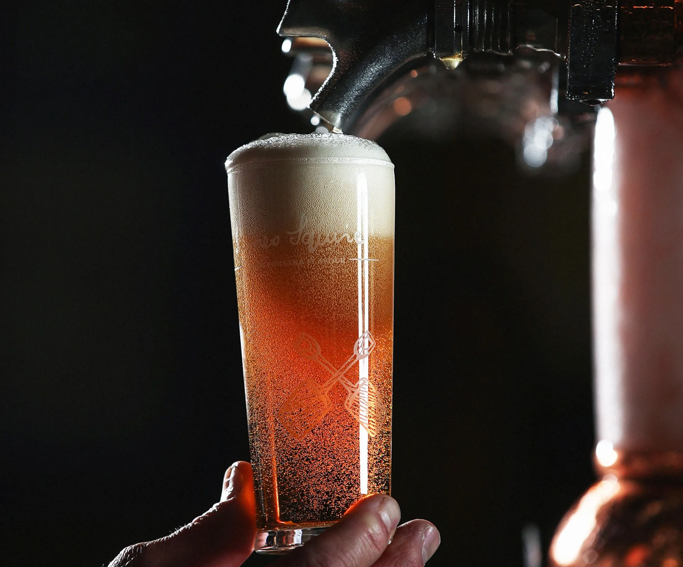 A glass of Jamie Squire Hop Thief American pale ale is poured from the beer tap ready for consumption at the Malt Shovel Brewery.