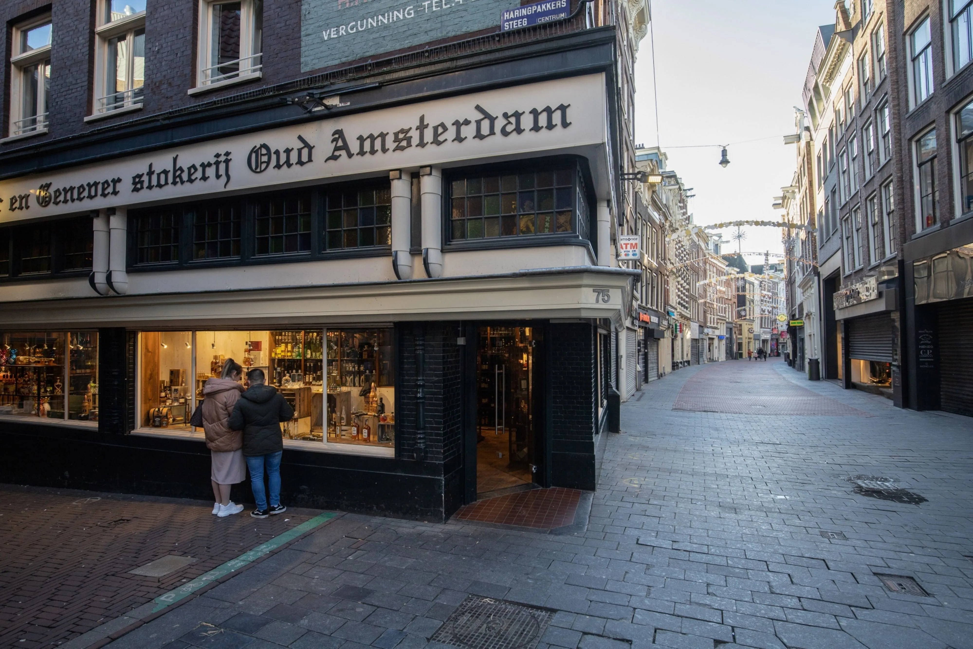 A retail street lined with closed businesses during the introduction of lockdown measures in Amsterdam&nbsp;on Dec. 21, 2021. The Dutch government has enforced a stricter lockdown to stem a surge in coronavirus infections caused by the spread of the omicron variant.
