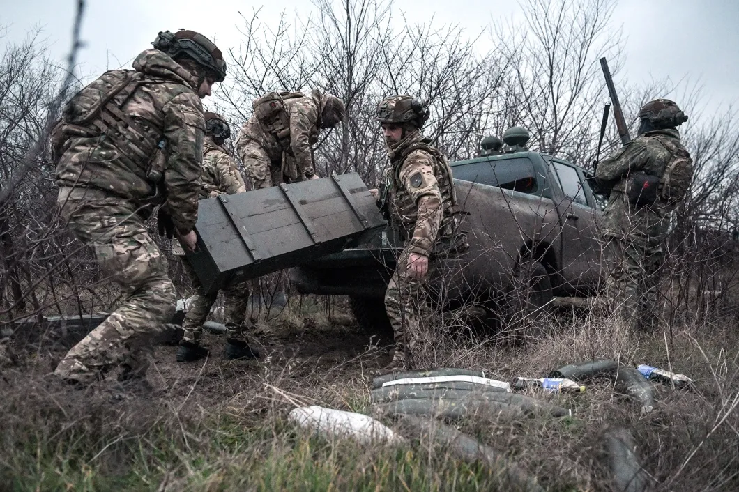 Soldiers of an artillery crew unload ammunition in the Zaporizhzhia region, Ukraine.