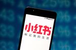 In this photo illustration the Xiaohongshu (RED) logo is