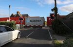 A driver waits at a level crossing in Felixstowe, UK. 