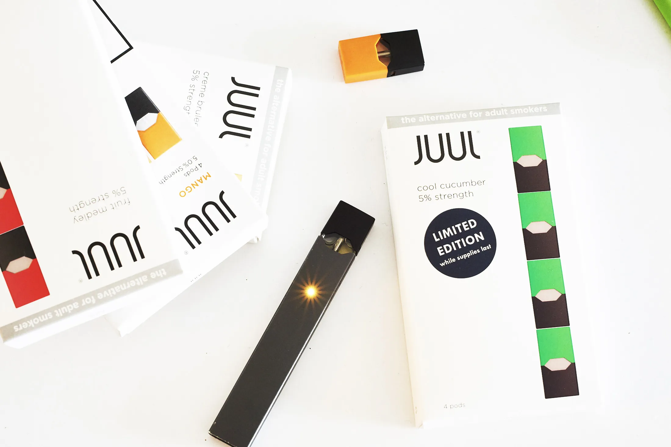 A Juul&nbsp;e-cigarette&nbsp;and a USB charger.