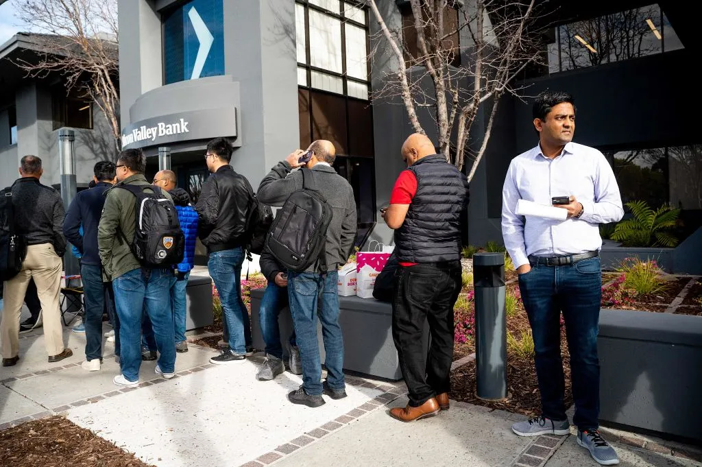 Silicon Valley Bank customers wait in line at the headquarters in&nbsp;California on March 13.&nbsp;
