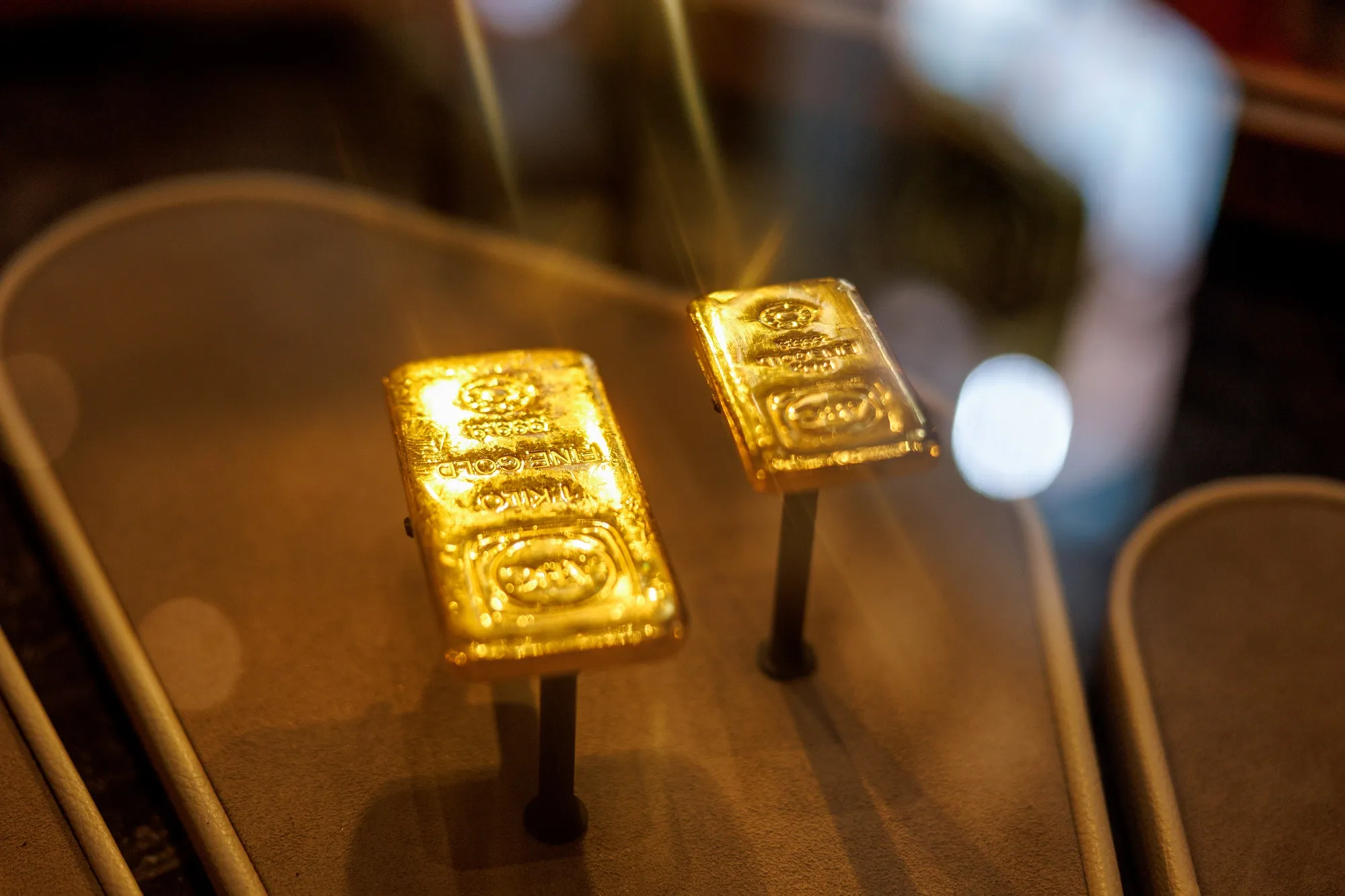 A one-kilogram, right, and 500-gram gold bar displayed at an ABC Bullion store in Sydney, Australia.