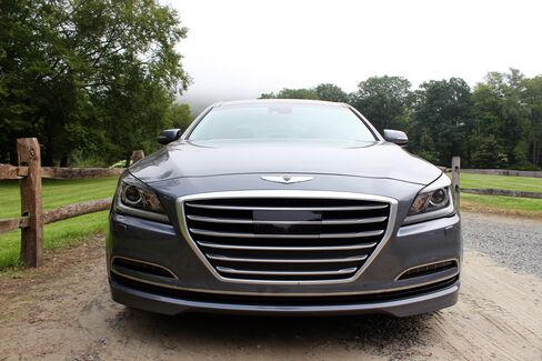 The Hyundai hood badge is big and mysterious.