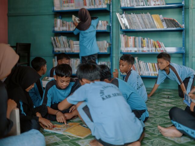 School children at a library in Muara Dua partially funded by the Rimba Raya project. Indonesia's government aims to raise billions through sales of carbon credits from existing and new projects.