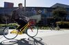 A cyclist rides a bicycle inside the Googleplex headquarters in Mountain View, California. Photographer: Michael Short/Bloomberg