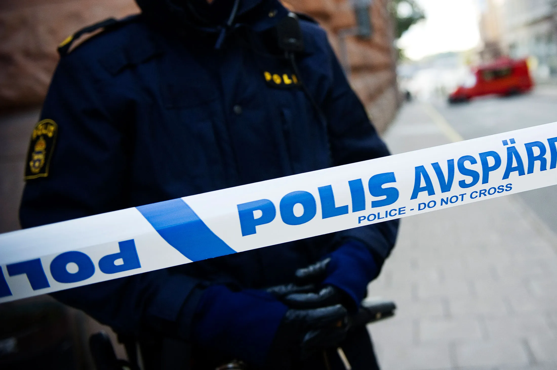 A police officer stands guard as a polic