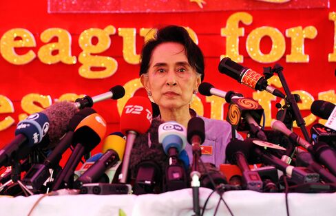 Opposition leader Aung San Suu Kyi addresses journalists during a press conference at her compound on Nov. 5.