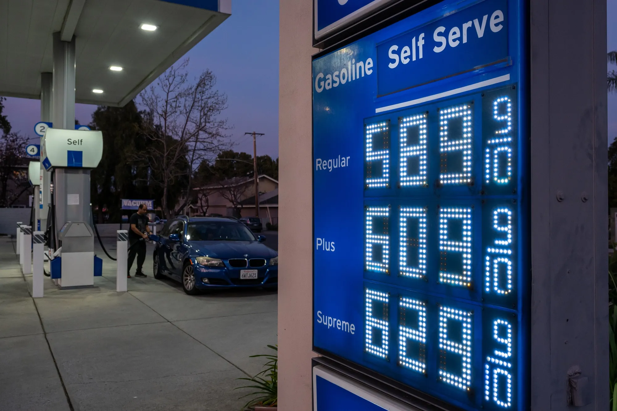 A sign displays the prices of unleaded gasoline at a Chevron gas station in Palo Alto, California.