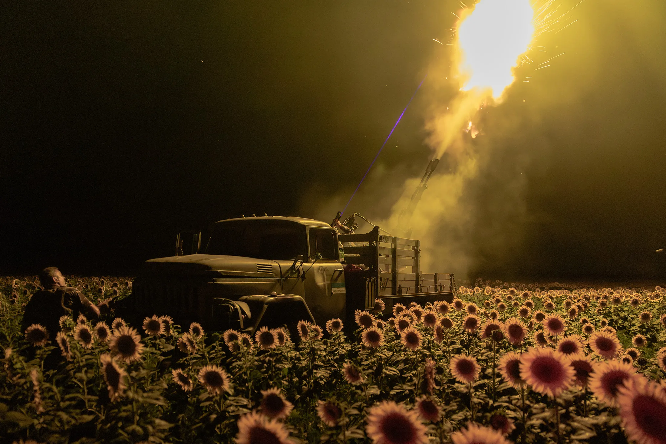 Ukrainian servicemen of the 59th brigade mobile air defense unit fire an anti-aircraft autocannon towards a Russian drone from a sunflower field&nbsp;near Pavlograd, Dnipropetrovsk region, Ukraine, on July 19.
