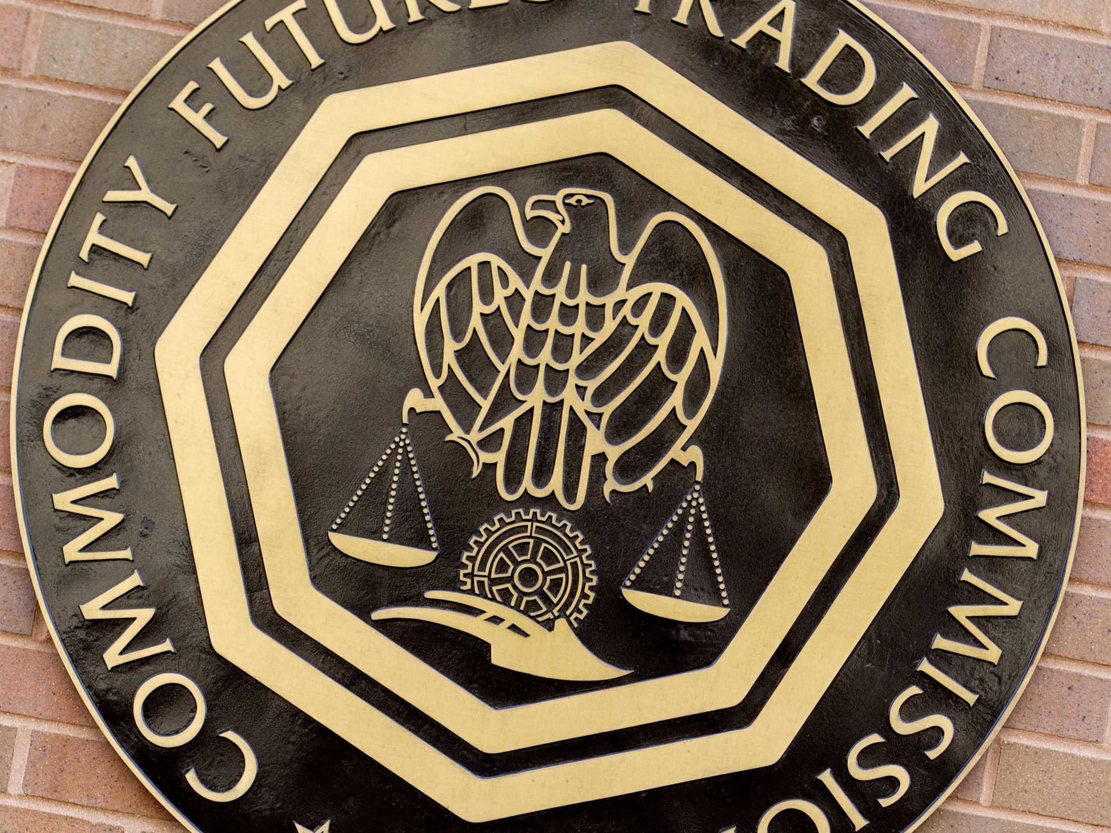The Commodity Futures Trading Commission logo hangs outside their headquarters in Washington, D.C.