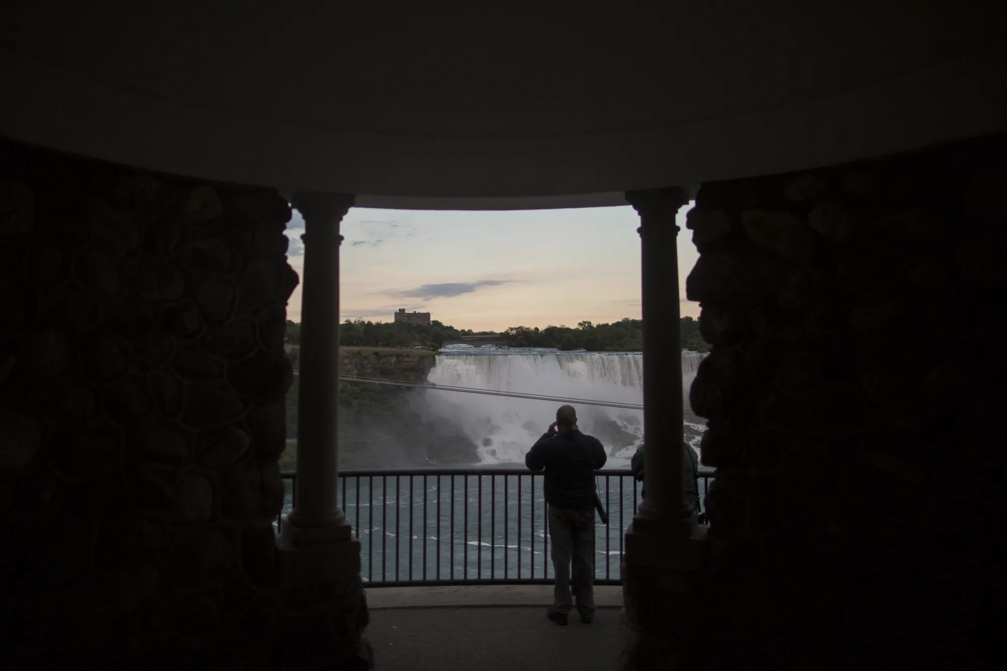A tourist takes a photograph of the American Falls in Niagara Falls, Canada in 2017.