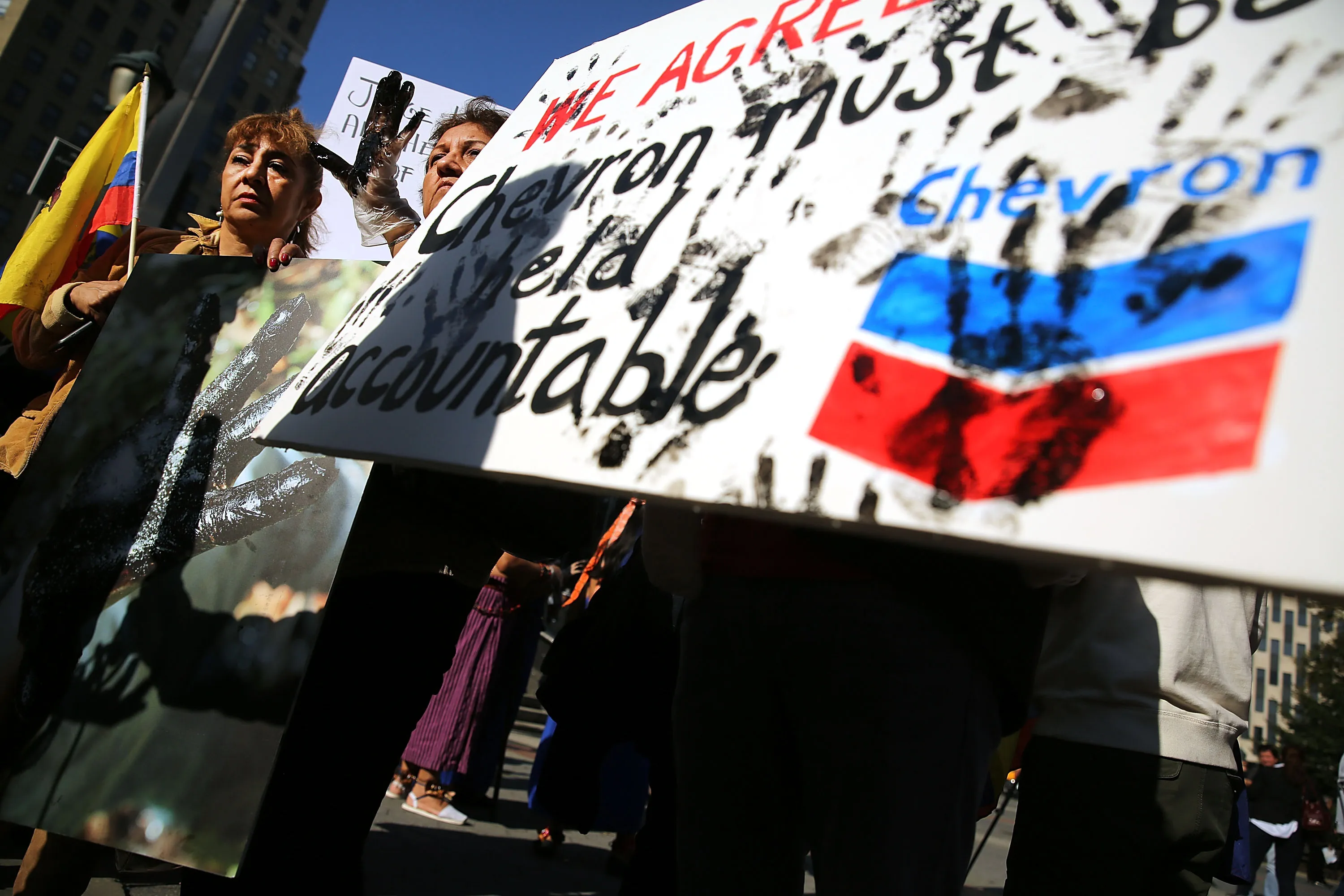 Protesters demonstrate in front of a New York City courthouse against Chevron on Oct. 15, 2013.
