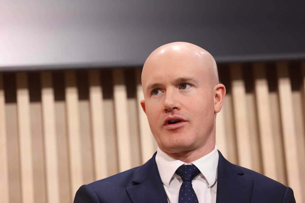 bloomberg.com - Emily Nicolle - Coinbase to Cut 14% of Workforce, Citing Volatile Markets and AI