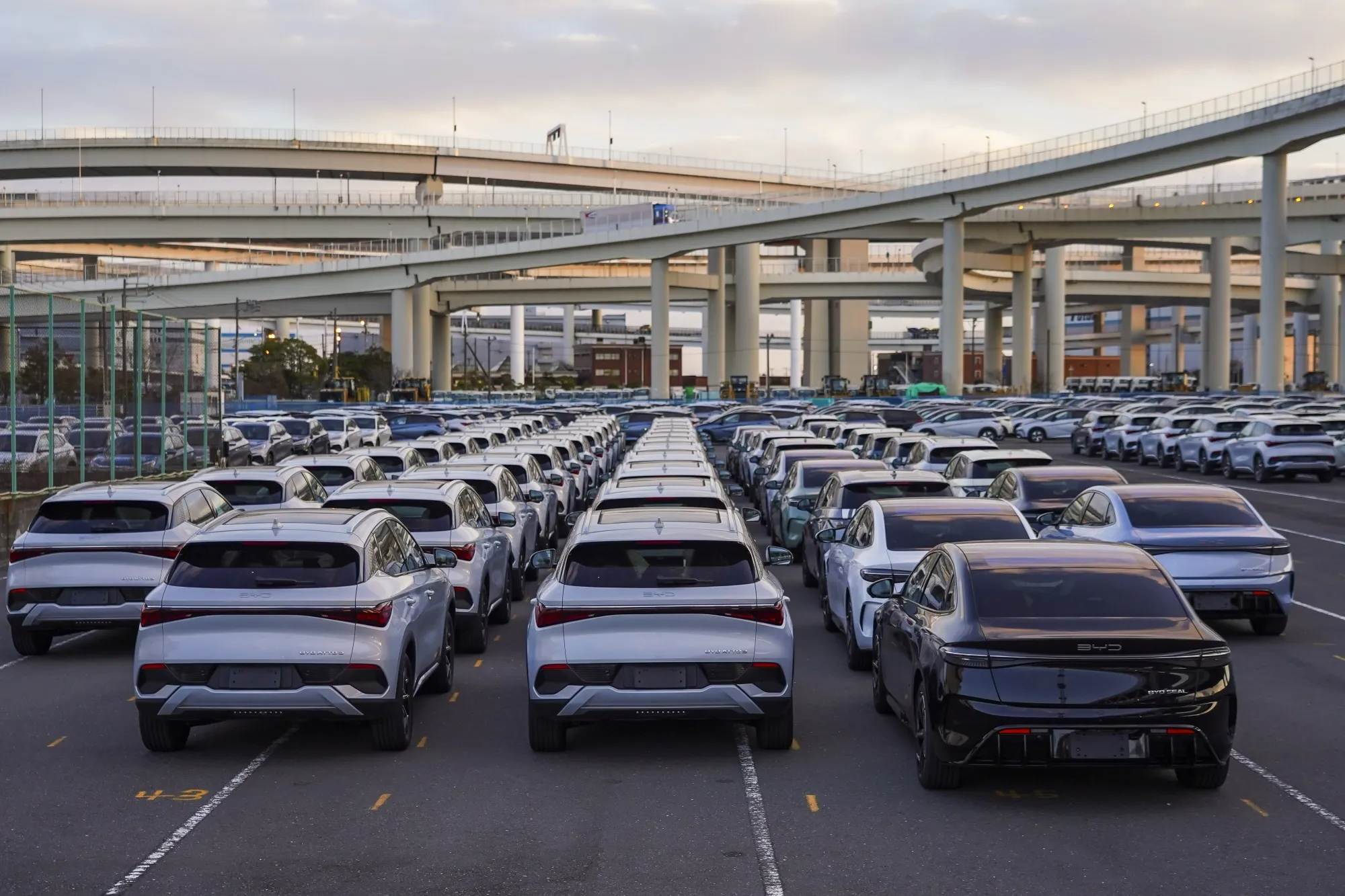 BYD Co. vehicles in a parking lot after arriving at a port in Yokohama, Japan.