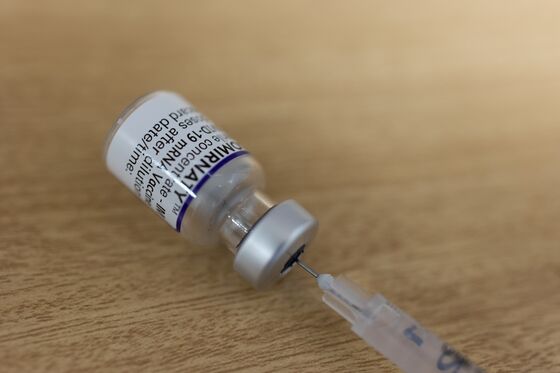 Singapore Warns Hospitals Strained; U.S. Boosters: Virus Update