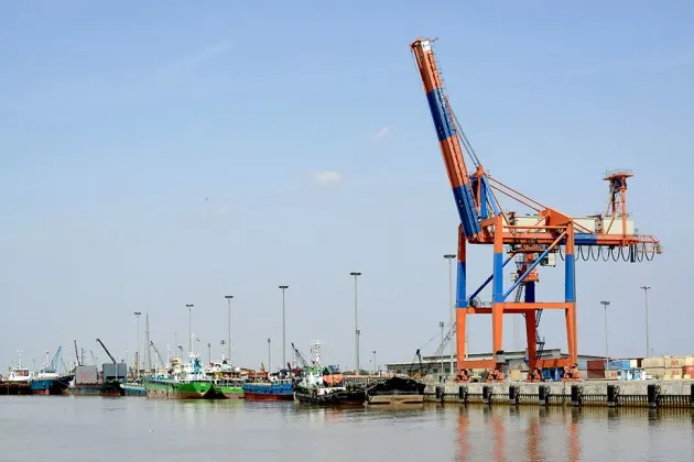 Cargo is unloaded from ships at port in Khorramshahr, Iran, on March 17