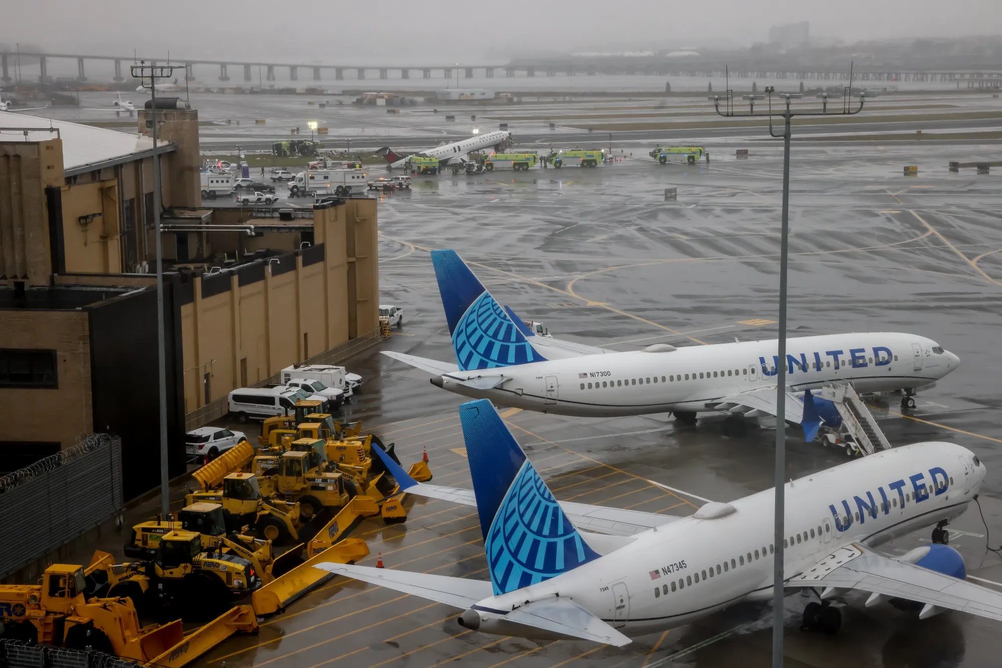 Emergency crews respond to an Air Canada Express plane on the tarmac after the plane collided with a fire truck at LaGuardia Airport in&nbsp;New York on March 23.