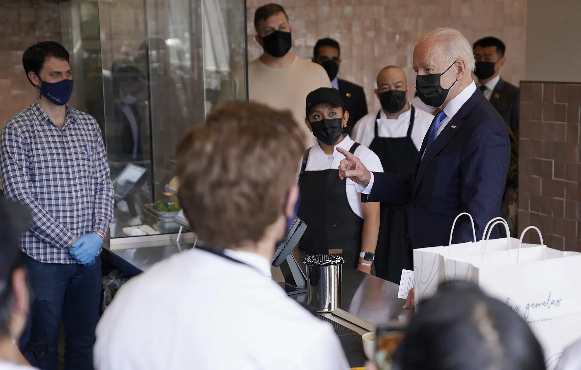 Joe Biden speaks with employees during a visit to Taqueria Las Gemelas in Washington, D.C. on May 5.