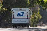 A U.S. Postal Service truck drives in Crockett, California, U.S., on Monday, Aug. 17, 2020.&nbsp;