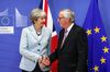 Theresa May, U.K. prime minister, left, shakes hands with Jean-Claude Juncker, president of the European Commission,.