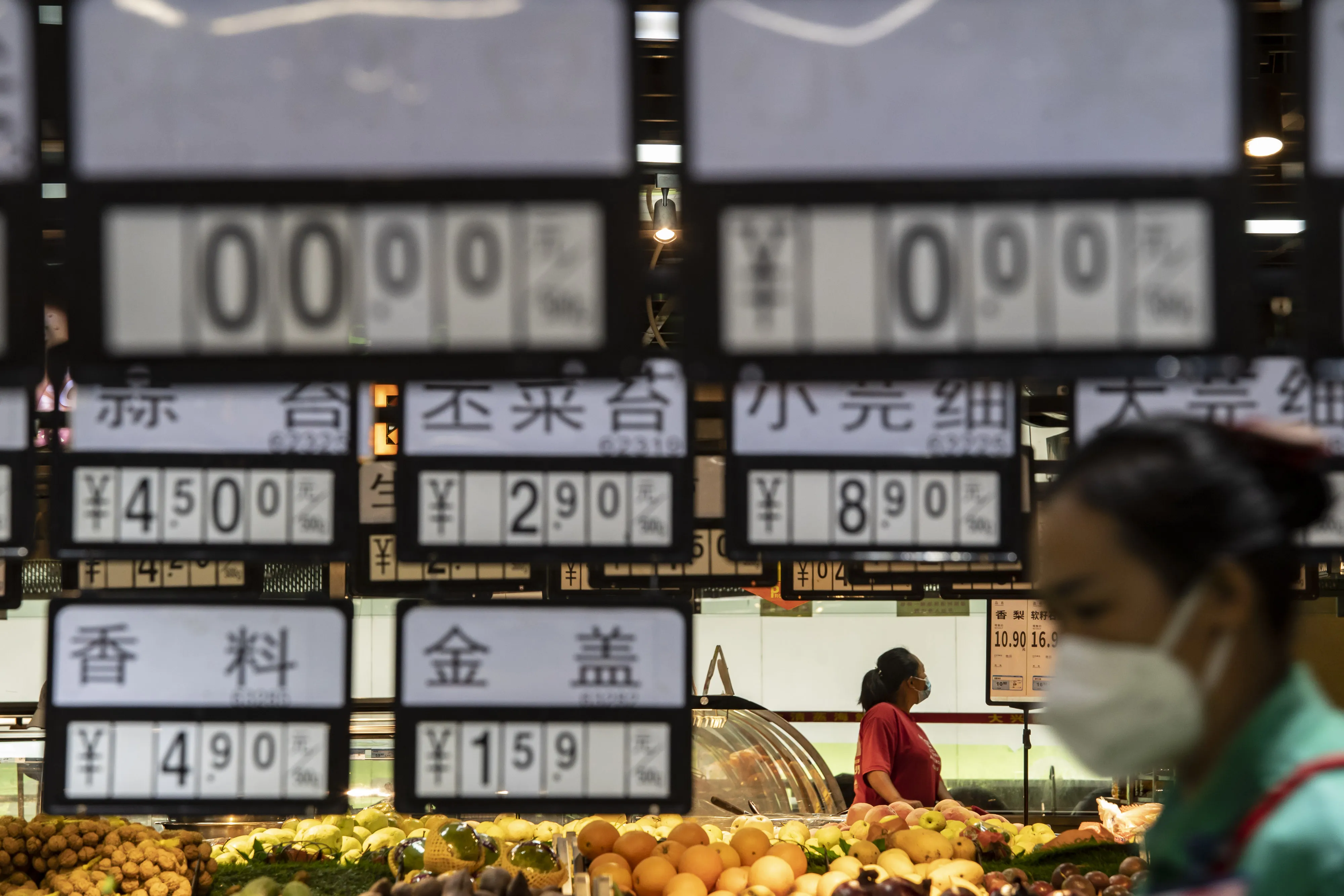 Customers at a supermarket in Ruili, Yunnan province, China.