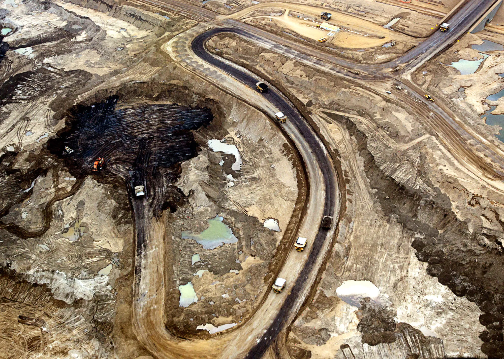 Oil is mined at Shell's Albian Sands mine near Fort McMurray, Alberta, Canada, on Tuesday, August 13, 2013.

