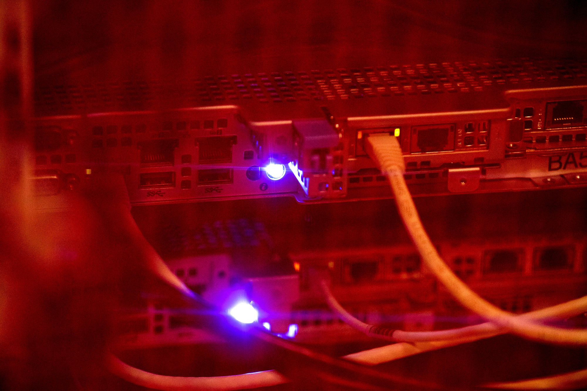 Illuminated lights on a server inside a data hall. Photographer: Brent Lewin/Bloomberg