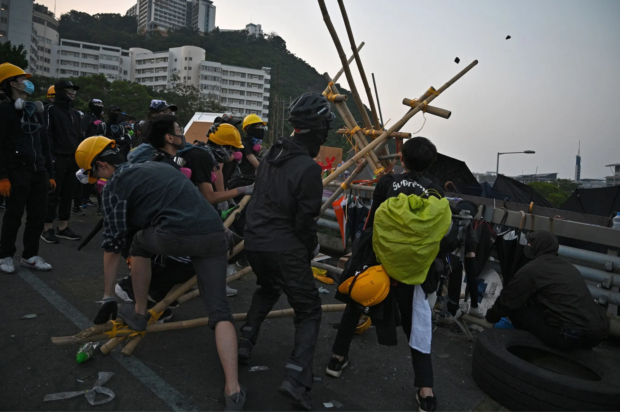 Protesters try out a catapult made with bamboo at CUHK on Nov. 13.