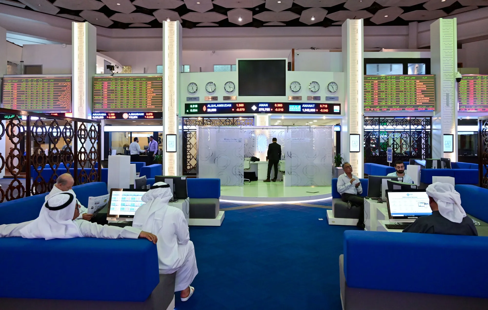 Traders follow financial markets at the Dubai Stock Exchange in the United Arab Emirates.&nbsp;