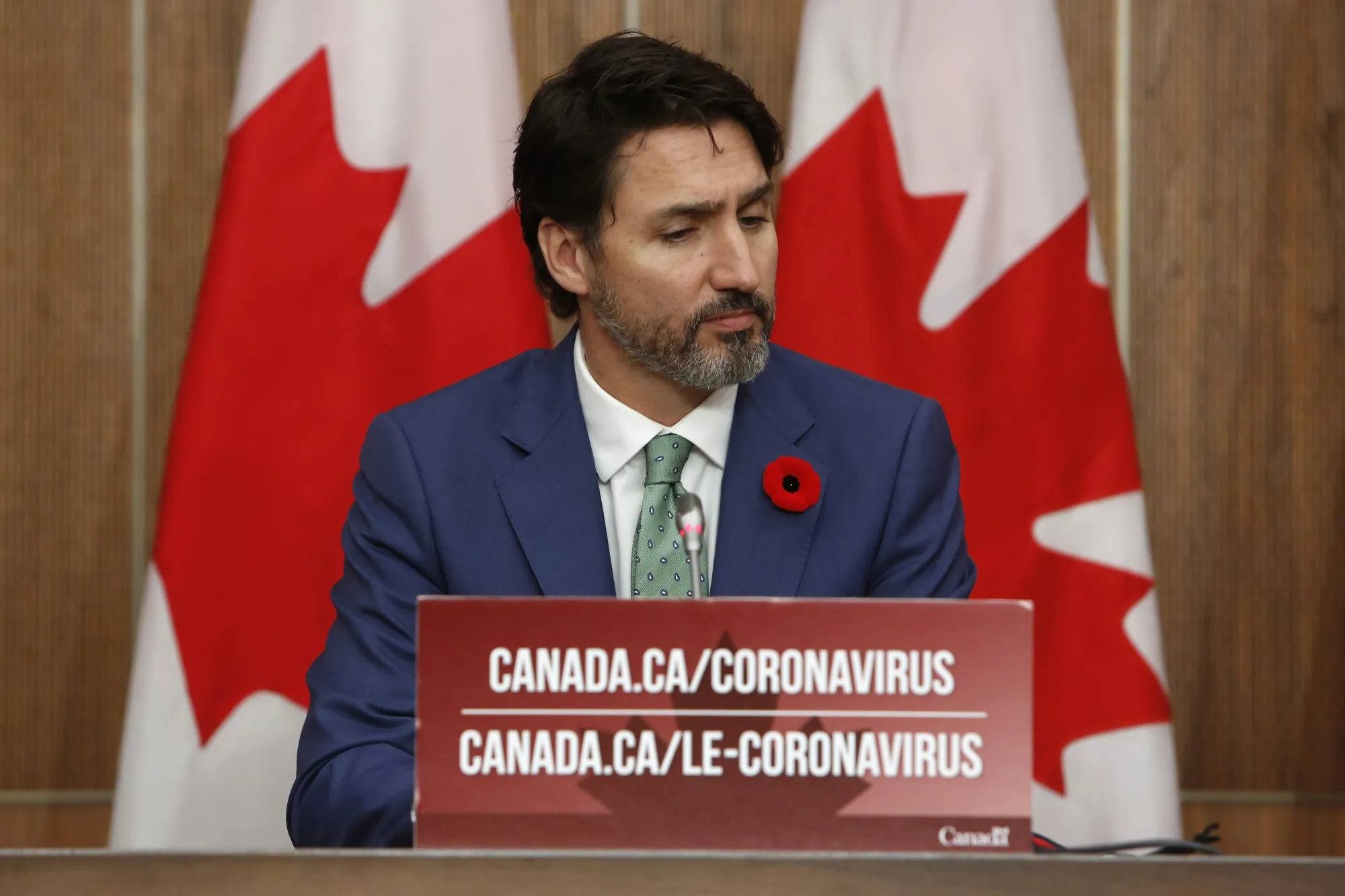 Justin Trudeau listens during an Ottawa news conference on Nov. 6.