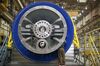 A worker checks on a component of an H-class gas turbine at the General Electric Co. Power & Water plant in Greenville, South Carolina.