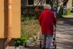 Senior Woman With Rollator And Shopping Bag