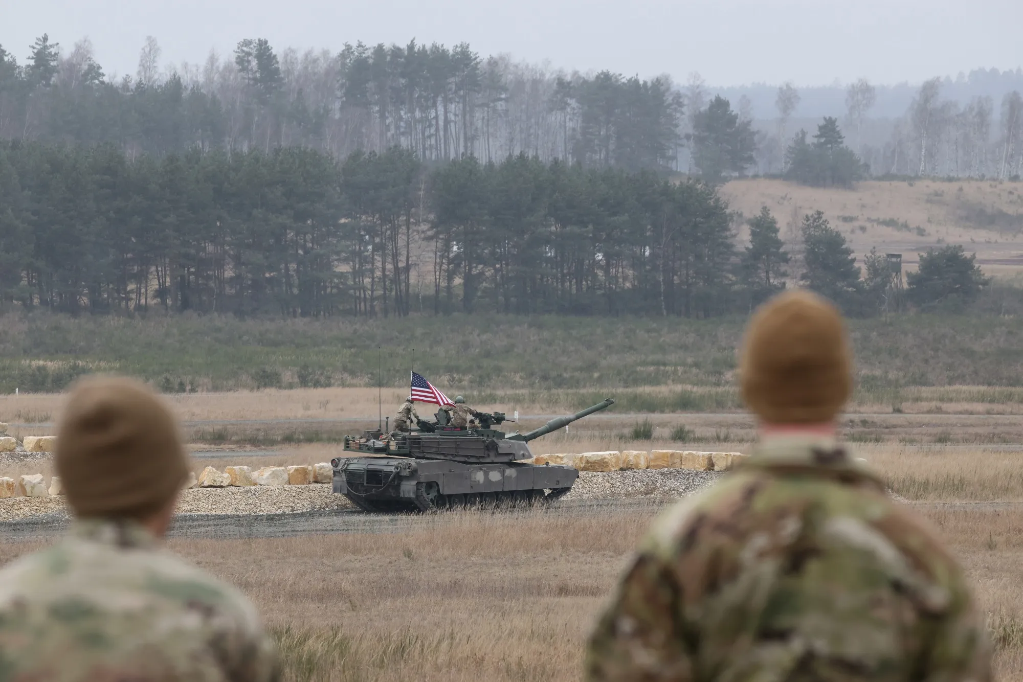 Soldiers look on as a US&nbsp;Army Abrams main battle tank participates in a military demonstration&nbsp;in Grafenwoehr, Germany.&nbsp;