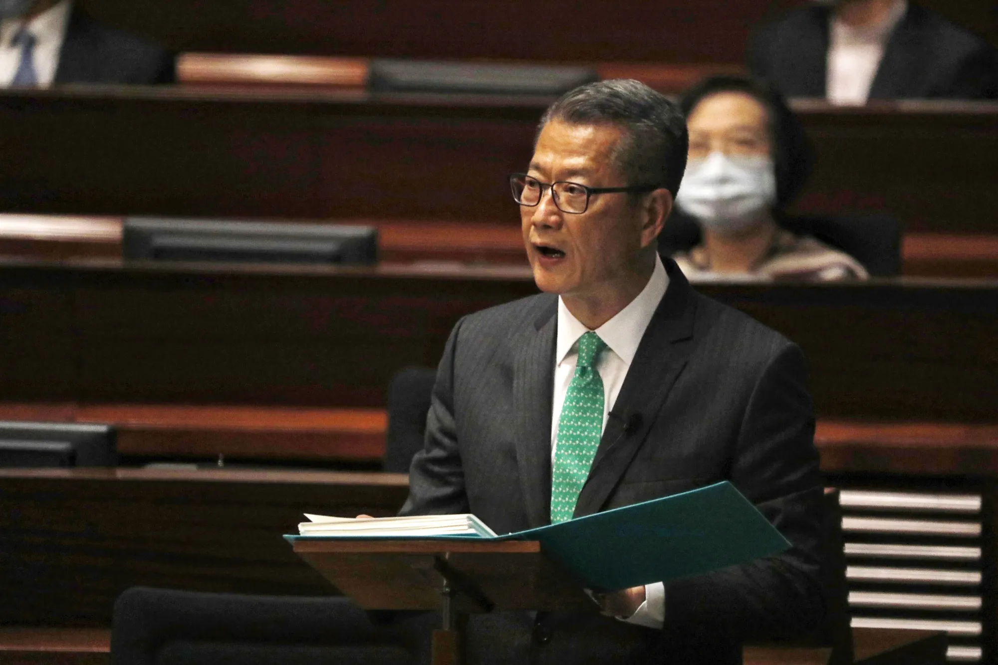 Paul Chan delivers his budget speech at the Legislative Council in Hong Kong on Feb. 24.