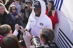 Georgia linebacker Nakobe Dean is greeted by a large crowd of fans as he and his teammates return to the Georgia campus, Tuesday, Jan. 11, 2022, in Athens, Ga., after defeating Alabama in the College Football Championship NCAA college football game. (AP Photo/John Bazemore)