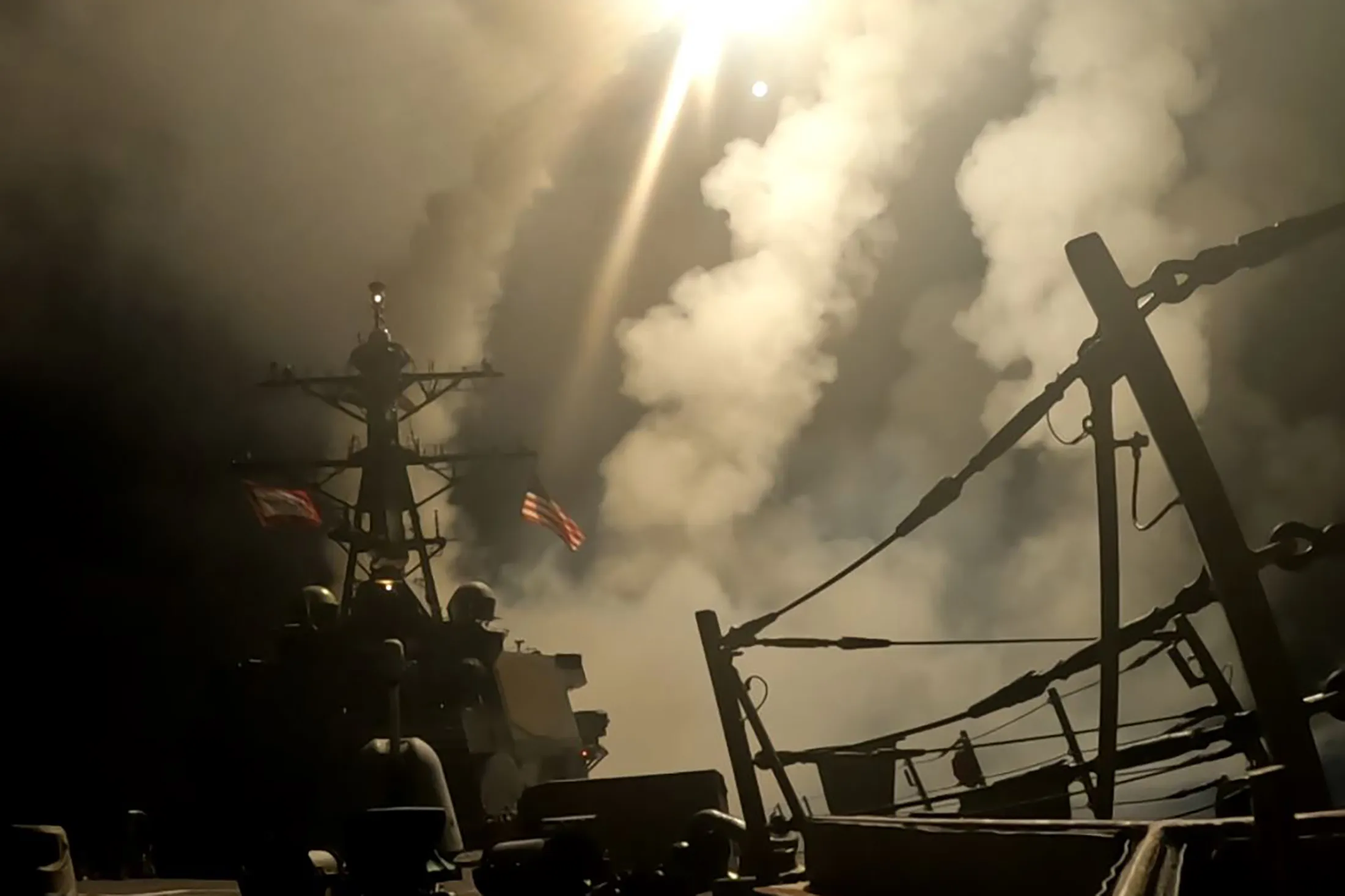 In this image provide by US Central Command, a US warship carries out precision airstrikes against Houthi targets across Yemen on March 15.