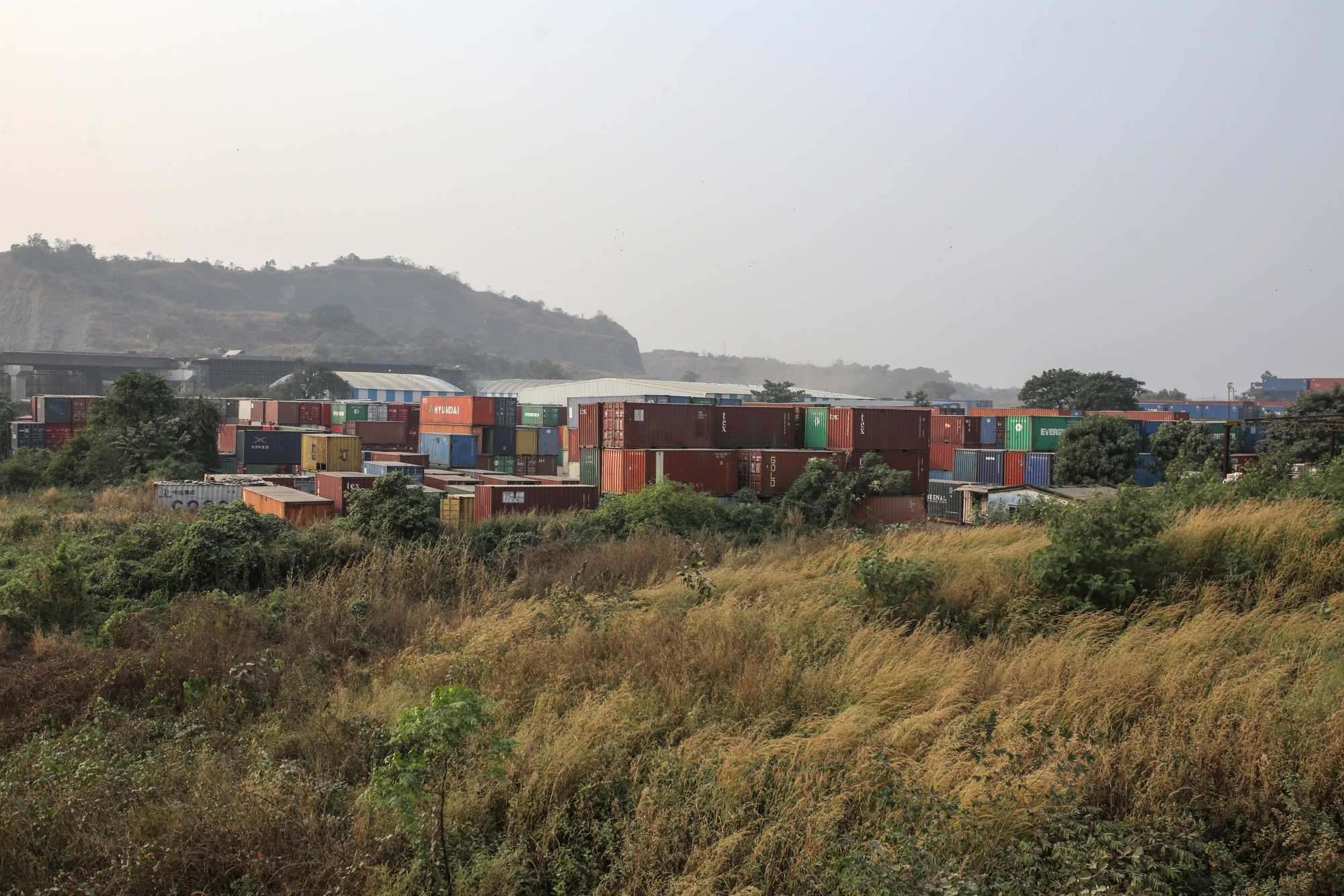 Shipping containers stacked at the Jawaharlal Nehru Port in Navi Mumbai, Maharashtra, India.