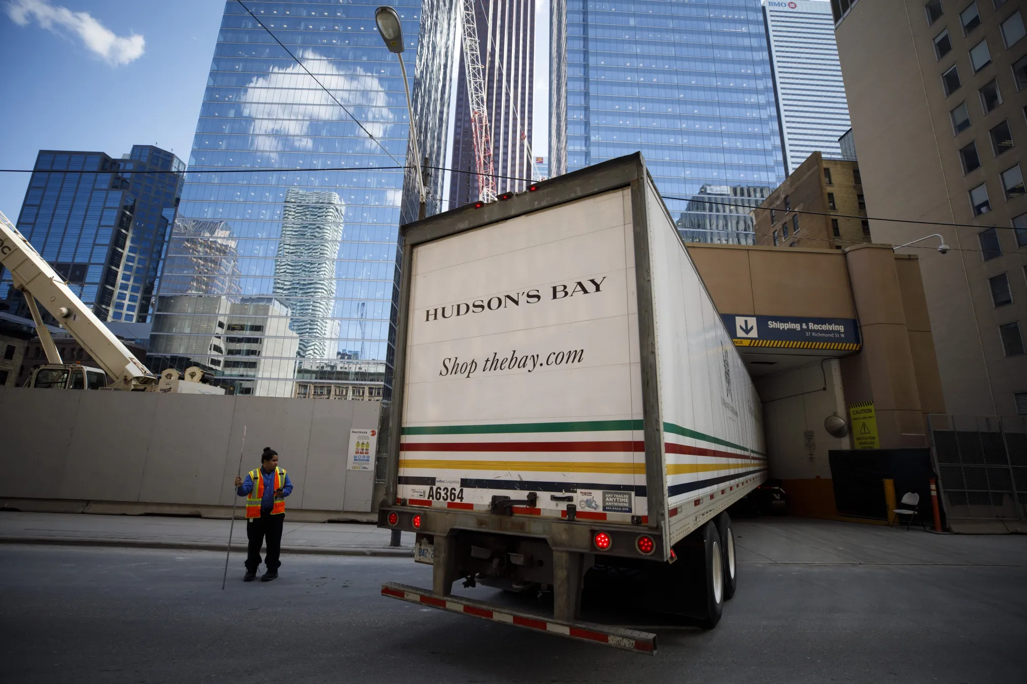 A delivery truck enters the Hudson's Bay head office and flagship store in Toronto.