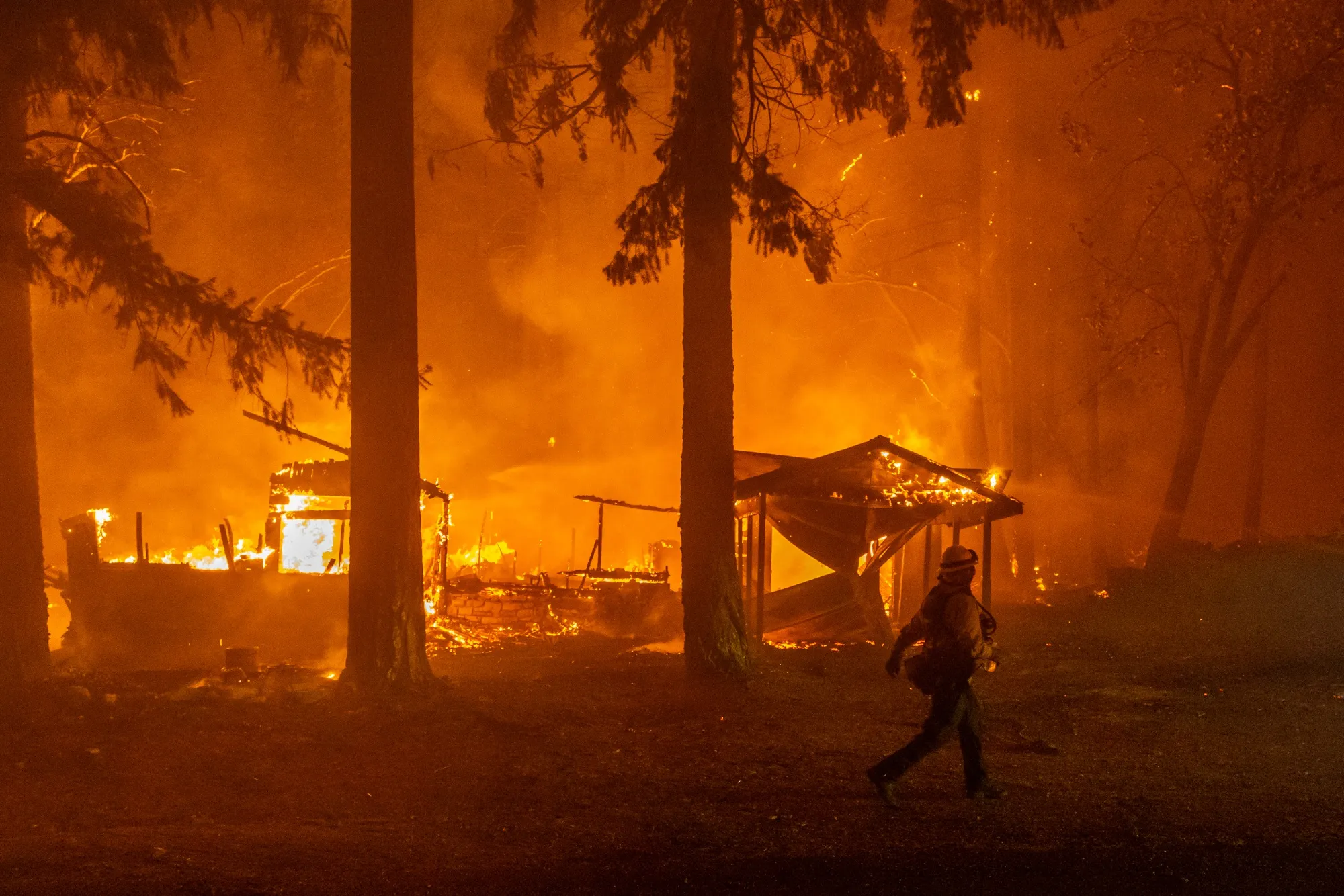 A firefighter during the Dixie Fire near Crescent Mills, California in July 2021.