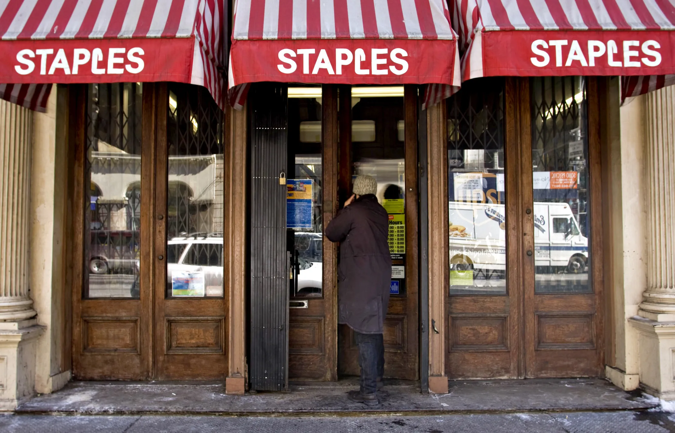 A customer enters a Staples retail store in New York.